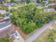 Vacant lot with mature trees near canal and homes at 122 Azalea Rd, Edgewater, FL 32141