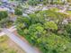 Waterfront lot with surrounding houses and trees at 122 Azalea Rd, Edgewater, FL 32141