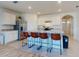 Modern kitchen with island, stainless steel appliances, and white cabinets at 126 Old Mill Pond Rd, Edgewater, FL 32141