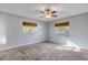 Spacious bedroom with ceiling fan and carpet flooring at 1732 Travelers Palm Dr, Edgewater, FL 32132