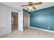 Bedroom with tile flooring, ceiling fan and open closet at 1732 Travelers Palm Dr, Edgewater, FL 32132