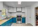 Updated kitchen with teal cabinets, butcher block countertops at 1732 Travelers Palm Dr, Edgewater, FL 32132