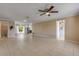 Open concept living area showcasing a view of the kitchen and backyard at 1732 Travelers Palm Dr, Edgewater, FL 32132