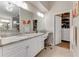 Main bathroom with double vanity and large walk-in closet at 1763 Weeping Elm Cir, Port Orange, FL 32128