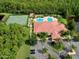 Aerial view of community clubhouse, pool, and tennis courts at 1763 Weeping Elm Cir, Port Orange, FL 32128