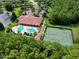 Aerial view of community pool, tennis courts, and clubhouse at 1763 Weeping Elm Cir, Port Orange, FL 32128