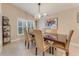 Elegant dining room featuring a wood table and modern chandelier at 1763 Weeping Elm Cir, Port Orange, FL 32128