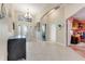 Tile entryway with view into living room and office at 1763 Weeping Elm Cir, Port Orange, FL 32128