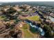 Aerial view of golf course community with homes and landscaping at 18459 Sw 66Th Loop, Dunnellon, FL 34432