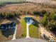 Aerial view of a house with a large yard at 18459 Sw 66Th Loop, Dunnellon, FL 34432