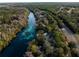 Aerial view showing riverfront property and homes at 18459 Sw 66Th Loop, Dunnellon, FL 34432