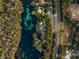 Aerial view of river, homes and lush vegetation at 18459 Sw 66Th Loop, Dunnellon, FL 34432