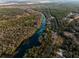 Aerial view of river, homes and surrounding landscape at 18459 Sw 66Th Loop, Dunnellon, FL 34432