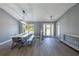 Bright dining room with farmhouse table and gray walls at 18459 Sw 66Th Loop, Dunnellon, FL 34432