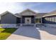 Inviting entryway with stone and gray siding at 18459 Sw 66Th Loop, Dunnellon, FL 34432