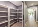 Walk-in pantry with ample shelving, offering great storage solutions at 18459 Sw 66Th Loop, Dunnellon, FL 34432