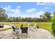 Circular patio overlooking lush greenspace and golf course views at 1957 Turnbull Lakes Dr, New Smyrna Beach, FL 32168