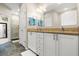 Double vanity bathroom with granite countertops at 1957 Turnbull Lakes Dr, New Smyrna Beach, FL 32168