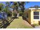 Side yard view of home and chain link fence at 1975 Lake Dr, New Smyrna Beach, FL 32168