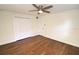 Bedroom with hardwood floors and ample closet space at 1975 Lake Dr, New Smyrna Beach, FL 32168