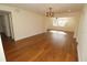 Open dining area with hardwood floors and a unique light fixture at 1975 Lake Dr, New Smyrna Beach, FL 32168