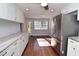 Modern kitchen featuring white cabinets and hardwood floors at 1975 Lake Dr, New Smyrna Beach, FL 32168