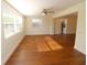 Spacious living room featuring hardwood floors and large windows at 1975 Lake Dr, New Smyrna Beach, FL 32168