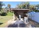 Covered workshop with storage space and gardening tools at 1975 Lake Dr, New Smyrna Beach, FL 32168