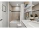 Bathroom with a tub-shower combo, decorative shelving, and neutral tile at 2 Riverwalk Dr # 402, New Smyrna Beach, FL 32169