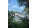 Private dock with boat access, surrounded by lush greenery and water views at 2 Riverwalk Dr # 402, New Smyrna Beach, FL 32169