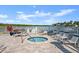 Outdoor hot tub and lounge chairs with views of the water at 2 Riverwalk Dr # 402, New Smyrna Beach, FL 32169