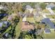 An aerial view of a home with a private yard in a lush, tree-lined neighborhood at 2232 Swoope Dr, New Smyrna Beach, FL 32168