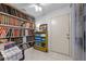 Functional storage room with shelving, cabinets, and tile floors at 2232 Swoope Dr, New Smyrna Beach, FL 32168