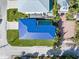 Bird's-eye view of a house with blue roof and a well-manicured lawn at 224 Condict Dr, New Smyrna Beach, FL 32169