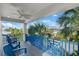 Relaxing balcony with blue chairs and city views at 224 Condict Dr, New Smyrna Beach, FL 32169