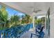 Private balcony with blue railing and ceiling fan at 224 Condict Dr, New Smyrna Beach, FL 32169