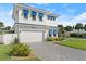 Front view of a two-story house with blue shutters at 224 Condict Dr, New Smyrna Beach, FL 32169