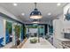 Kitchen island with white countertop and a view of the pool at 224 Condict Dr, New Smyrna Beach, FL 32169