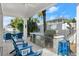 Stone-finished outdoor kitchen with grill and seating area at 224 Condict Dr, New Smyrna Beach, FL 32169