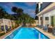 Inviting pool with waterfall feature and lounge area at 224 Condict Dr, New Smyrna Beach, FL 32169