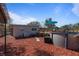 A backyard features an above-ground pool, a wooden deck, and unique landscaping at 229 Columbus Ave, Daytona Beach, FL 32118