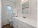 Bright bathroom with a stylish vanity, ample storage, and tiled walls at 229 Columbus Ave, Daytona Beach, FL 32118