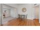 Cozy dining area with wood floors, a round table, and natural light at 229 Columbus Ave, Daytona Beach, FL 32118