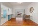 Open dining area with hardwood floors, seamlessly connected to the kitchen and adjacent living spaces at 229 Columbus Ave, Daytona Beach, FL 32118