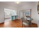 Bright dining room with hardwood floors, opening to the kitchen and offering views to other living spaces at 229 Columbus Ave, Daytona Beach, FL 32118