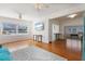 Open-concept living room with hardwood floors and a seamless transition to the adjacent kitchen and dining area at 229 Columbus Ave, Daytona Beach, FL 32118