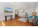 Bright and airy living room with hardwood floors, white walls, and ample natural light from large windows at 229 Columbus Ave, Daytona Beach, FL 32118