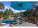 View of a pool area with a table and chairs, perfect for entertaining at 229 Columbus Ave, Daytona Beach, FL 32118