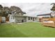 Outdoor kitchen and expansive backyard at 2307 Saxon Dr, New Smyrna Beach, FL 32169