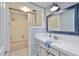 Bathroom with tub, shower and vanity at 2307 Saxon Dr, New Smyrna Beach, FL 32169